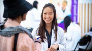 Doctor of pharmacy student with patient at Medicare Part D clinic