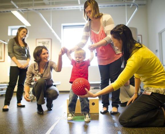 PT students working with child in clinic